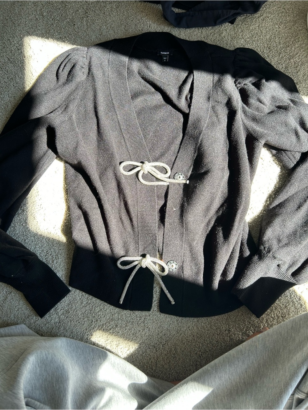 Express cardigan with bow buttons
